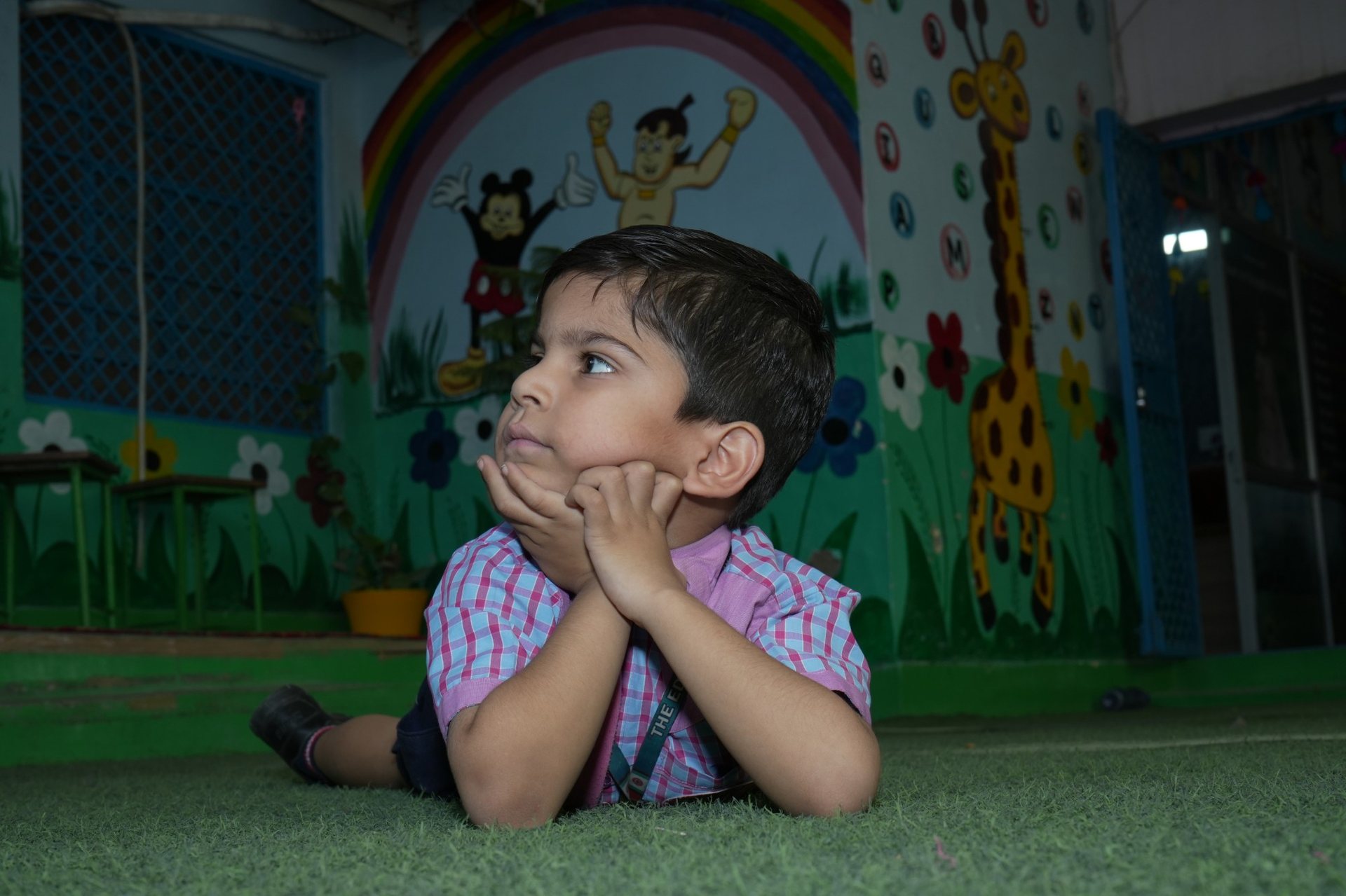 A student lost in thought during playtime