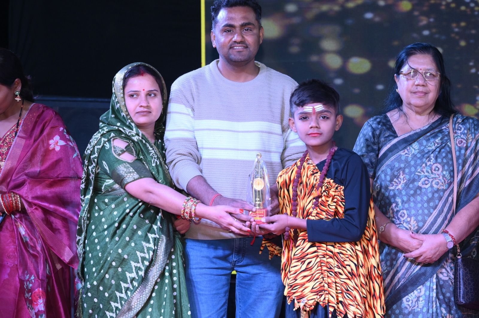 A proud family celebrating an award