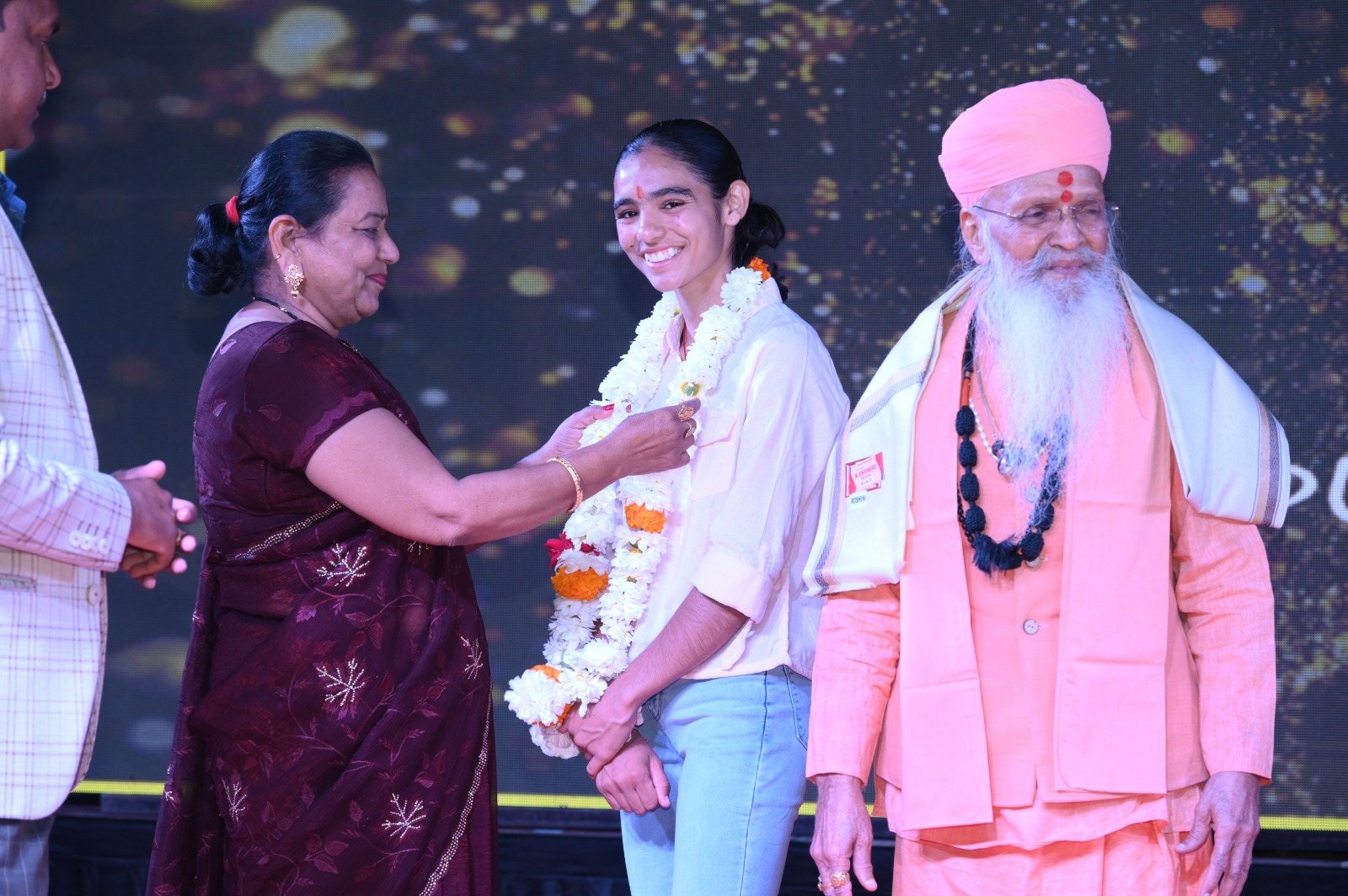 Honouring a young achiever on stage